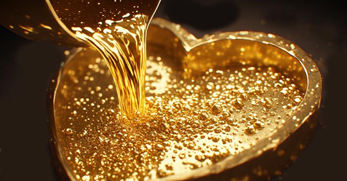 liquid gold and silver being poured into a heart shaped mould