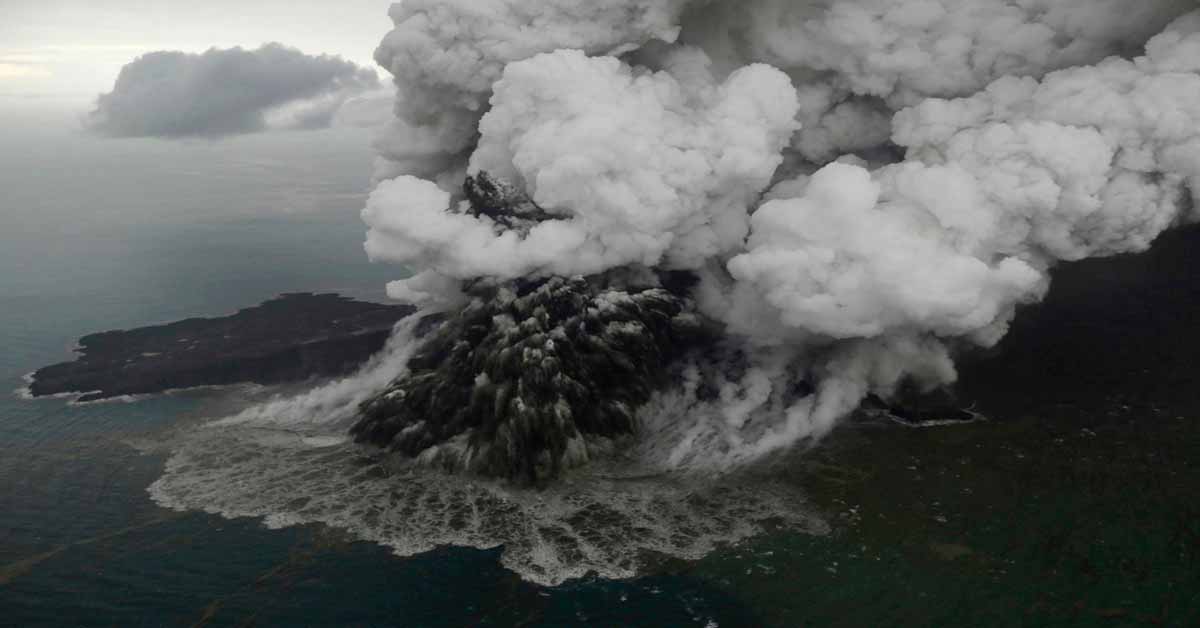 a volcano island erupting out of the sea