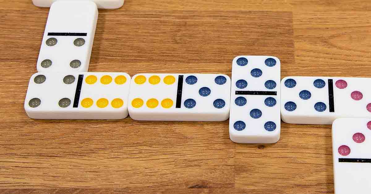 Dominoes lined up on a table